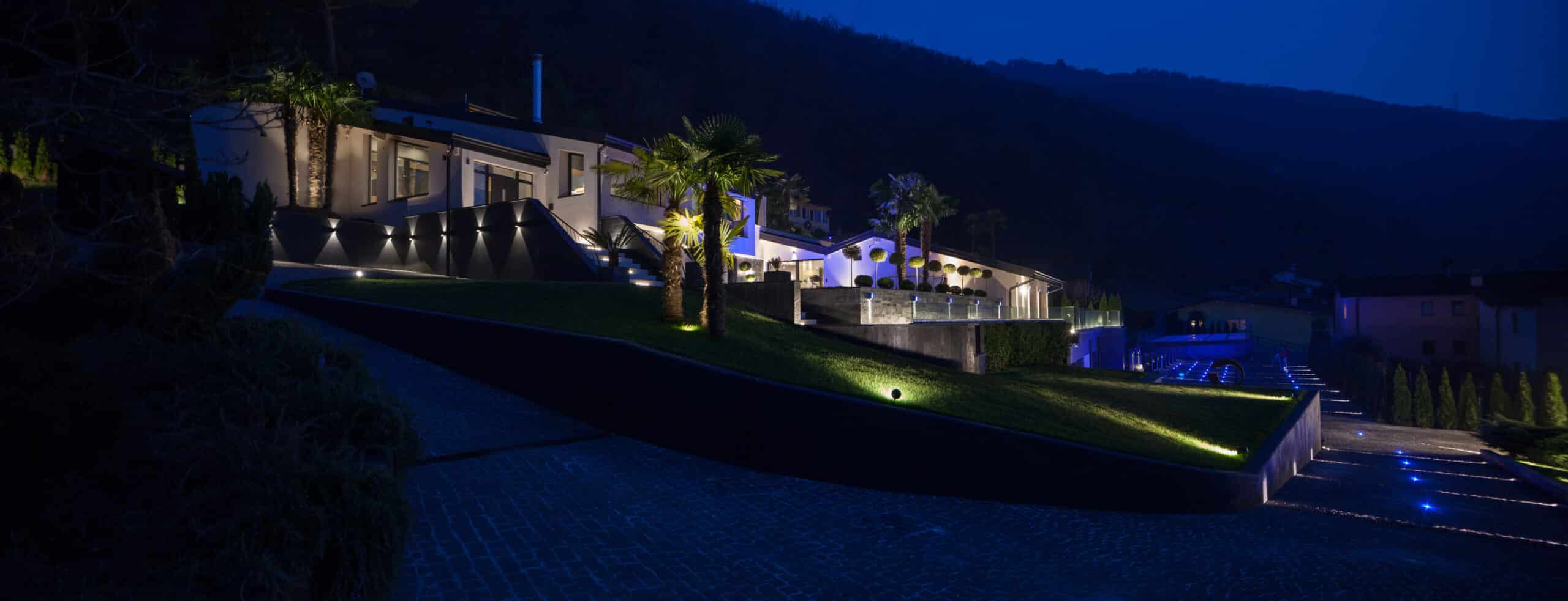 Exterior view of a modern luxury villa, with outdoor Lighting in the Winter