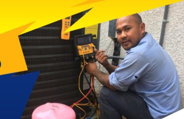 Technician repairing Air Conditioner
