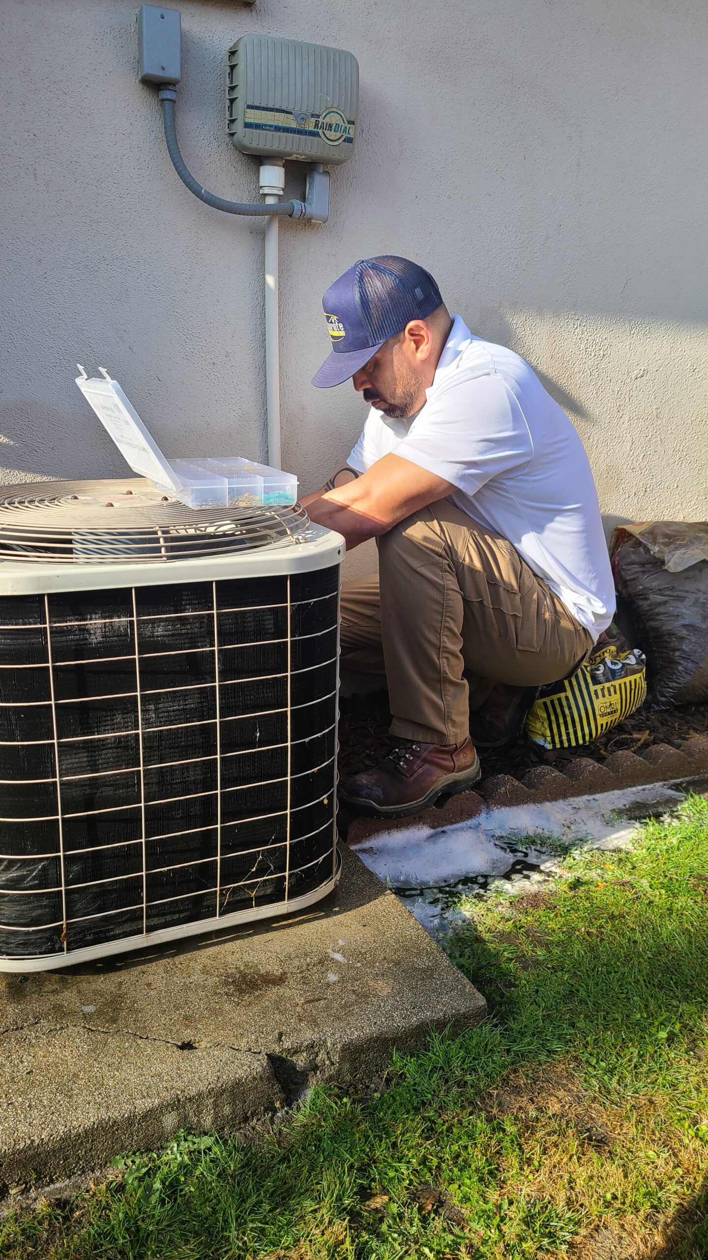 Accurate Air HVAC Tech working outside a Rancho Cucamonga home